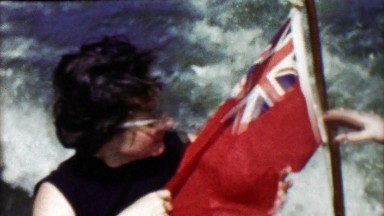 1963: Women pleasure boating Ren Ensign UK flag on civilly registered vessel.