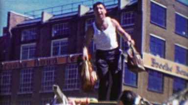 1963: Gregarious Italian Merchant Throwing Handbag Purses Into Crowd