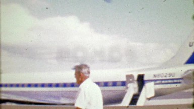 1964: United Airlines Pilot Greets Mature Woman Passenger Outdoors