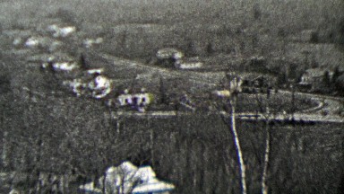 1937: Countryside rural living estate homes in valley below.