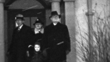 1937: Family leaving home winter weather snowstorm outdoors threatening.