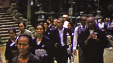 1951: Japanese senior citizens walking sacred temple grounds.