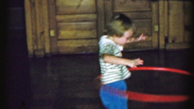 1958: Young Girl Practicing Hula Hoop Dance Craze in Ames, Iowa