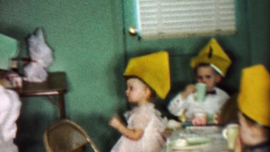 1955: Toddler birthday party funny homemade paper hats.