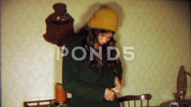 1967: Teenage Fashion Student Girl in Colorful Trenchcoat Inside