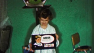 1958: Girl Shows Junior Doctor Kit Christmas Gift