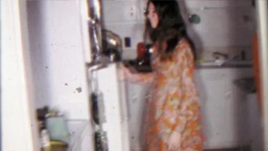 1968: College student hippy girl gets creamed corn from refrigerator.