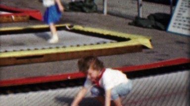 1958: Girl Jumping Wildly on Bouncy Square Trampoline