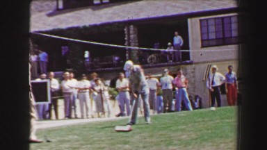 1968: Professional Golf Tournament Tees Off on 1st Hole at Clubhouse, Crowd Watches
