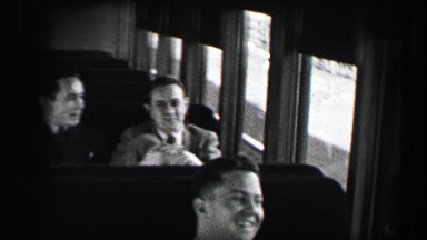 1937: Harvard University students on train traveling home for the holidays.