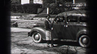 1939: Friendly neighbor southern hospitality woman chatting up car driver