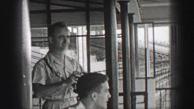 1938: Hialeah Park horse racetrack men tour empty epic stadium structure.