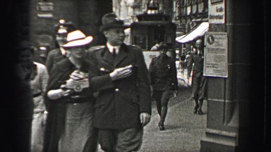 1937: Nazi SS Schutzstaffel officer keeping tabs on public streets. BERLIN,