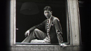 1937: Sharply Dressed Business Scholar Posing on Window Sill
