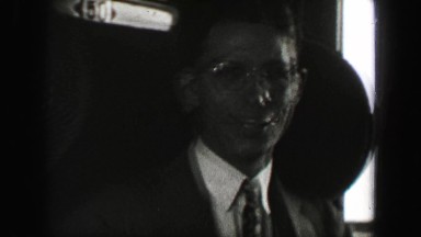 1937: Young dapper sharply dressed starry eyed college student riding train
