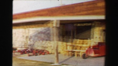 1968: Newly constructed golf clubhouse in barren southwestern USA desert driving