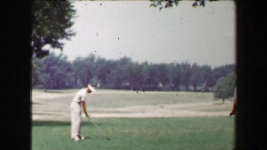 1968: Young Strong Man Driving Golf Ball as Friends Watch with Closeup Extra.