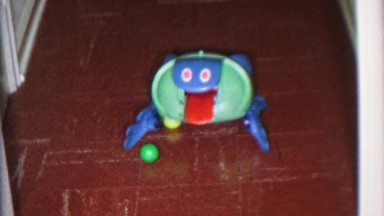1965: Wacky robot toy chasin a ping pong ball sticking out tongue play. CEDAR