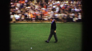 1969: Golf tournament golfer annoyed angry stomps around toss ball to caddie.