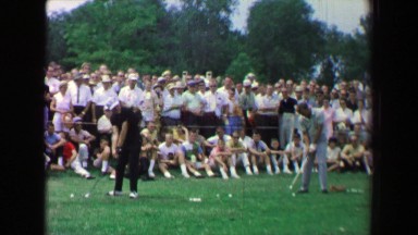 1969: Golf tournament practice session expo men hitting balls driving range.