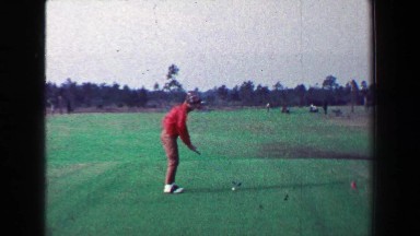 1968: Woman golfer shanks drive for course tee walks back to cart. LOS ANGELES,