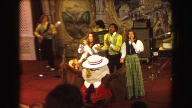 1970: Busch Gardens mascot leading singing performance group ending song. ST.