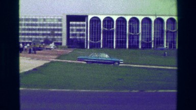 1977: Government Building Cars Passing By Busy Urban Community College