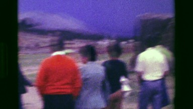 1977: Coca Cola sign at South American airport parking lot taxi transport row.