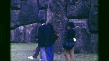 1977: Tourist group explore Saksaywaman Inca civilization ancient ruins. CUSCO,