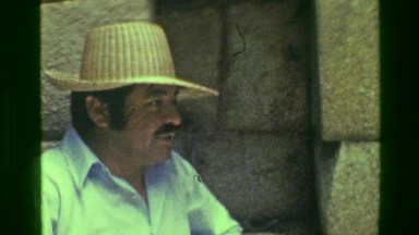 1977: Interior Machu Picchu native Inca civilization ruins buildings tour group.