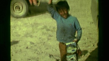 1977: Poor Young Street Child Excitedly Waving Hello and Yelling While Working for Tips