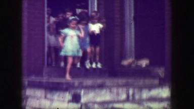1949: School children leaving class down steep slippery concrete staircase, no