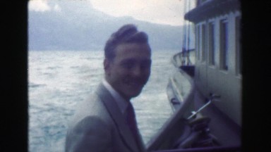 1949: Formally Dressed Man Enjoying River Cruise in Nice, France