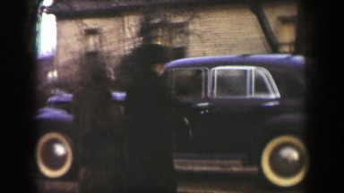 1939: Man Escorts Girlfriend to Car as Suitor Attempts to Impress Her