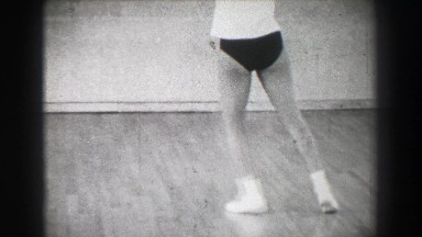 1966: Jazz dance moves 8 closeup behind kick stepping shuffle slide. NEW YORK