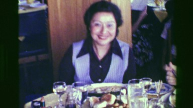 1976: Happy restaurant goers dining seafood stew shrimp scampi dish. SAN JOSE,
