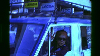 1976: Gypsy woman driving car yapping gums sticking head out window. SAN JOSE,