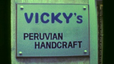 1976: Vicky's Peruvian Handcraft Store in Colon, Panama — Woman Shopping at Artisan Market