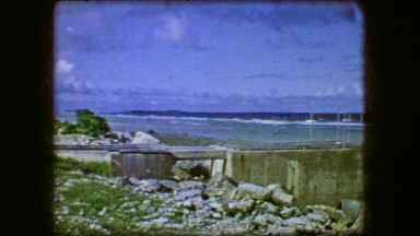 1944: Concrete Embankment Ruins Blue Sky Ocean Beach Exposed Rocky Surf