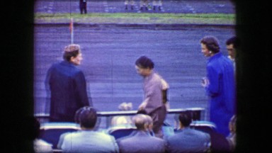 1944: Japanese Woman Bowing and Shaking Caucasian Woman's Hand Awkwardly