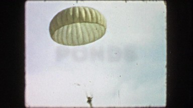 1944: Full Parachute Landing by Soldier During Military Training Exercise