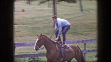1956: Teenage Boy Riding Horse Standing Up Smoking Cigarette Cocky Showboat