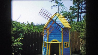 1955: Storyland theme park windmill exhibit boy storybook characters.