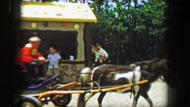 1955: Storyland theme park 10 cent pony rides driving around amusement park.