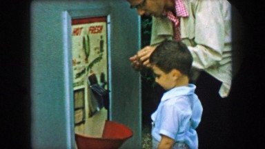 1957: Dad Buying Son Coin-Operated Fresh Popcorn Machine in Glen, New Hampshire