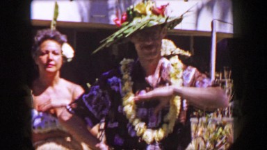 1958: Male Tourist hula dancing for the crowd in costume