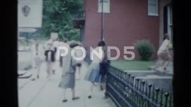 1959: Cape Cod summer beach umbrella sand colorful vacation. CAPE COD, MASS.