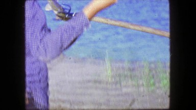 1961: Spearfishing Carp With Polespear And Trident At Lake Shore