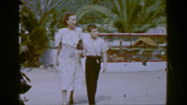 1953: Mother Holding Son's Hand at Zoo Amusement Park Attraction
