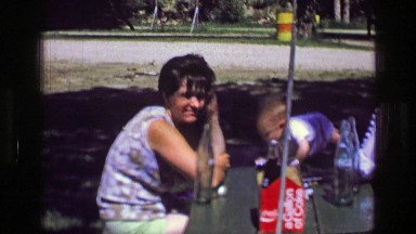 1957: Family picnic table coca cola soda glass beverage bottles Gallon of Coke.